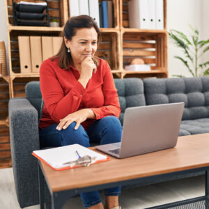 women's health in Nashville, TN, a woman looking at a computer and looking for a concierge physician