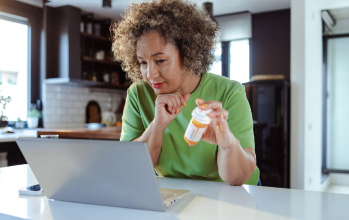 Adult ADHD treatment in Nashville, a woman looking at her computer online.